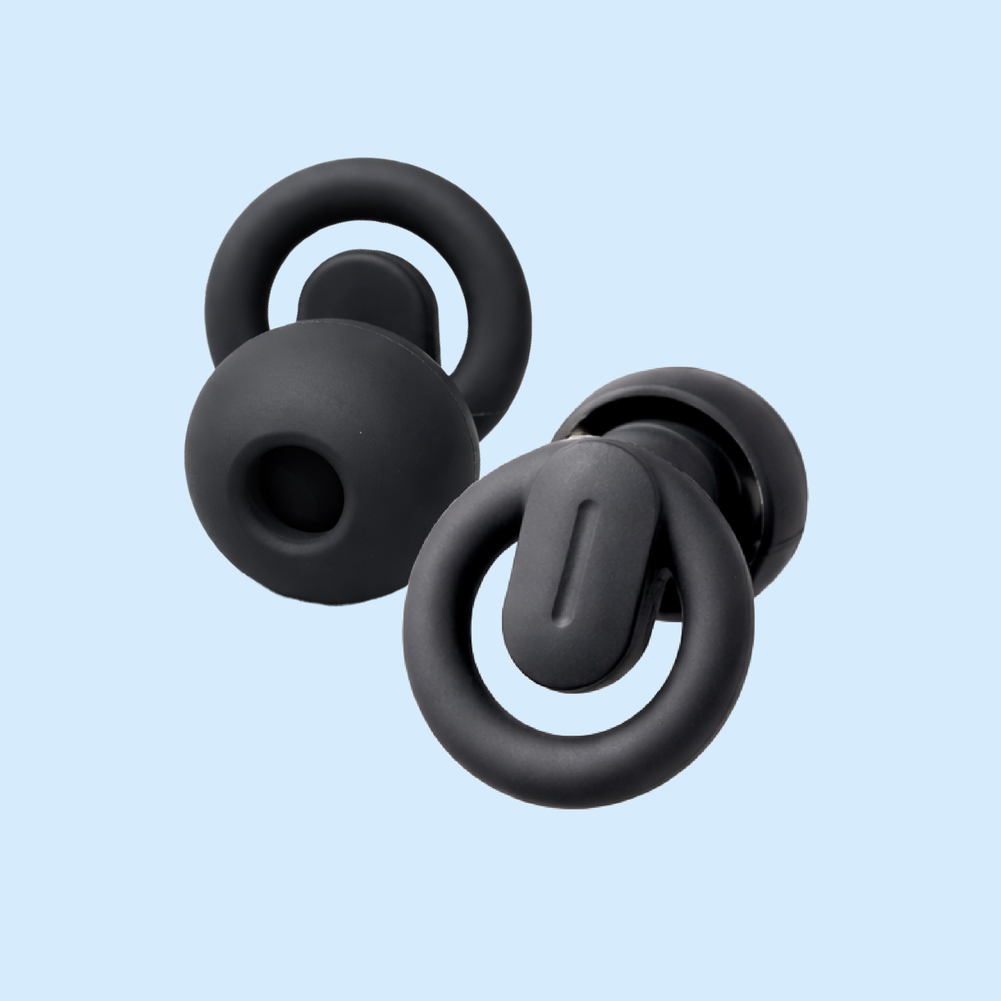 Black silicone earbud tips on a light blue background