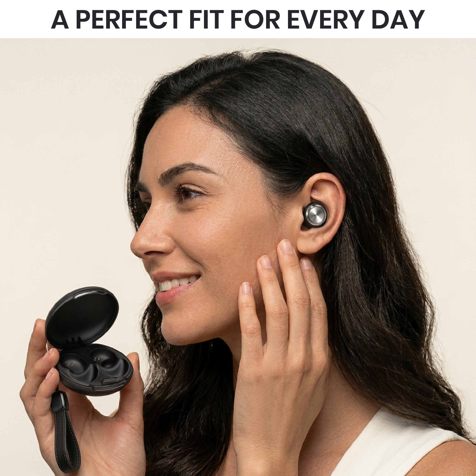 Woman wearing wireless earbuds with a beige background and text 'A PERFECT FIT FOR EVERY DAY'.