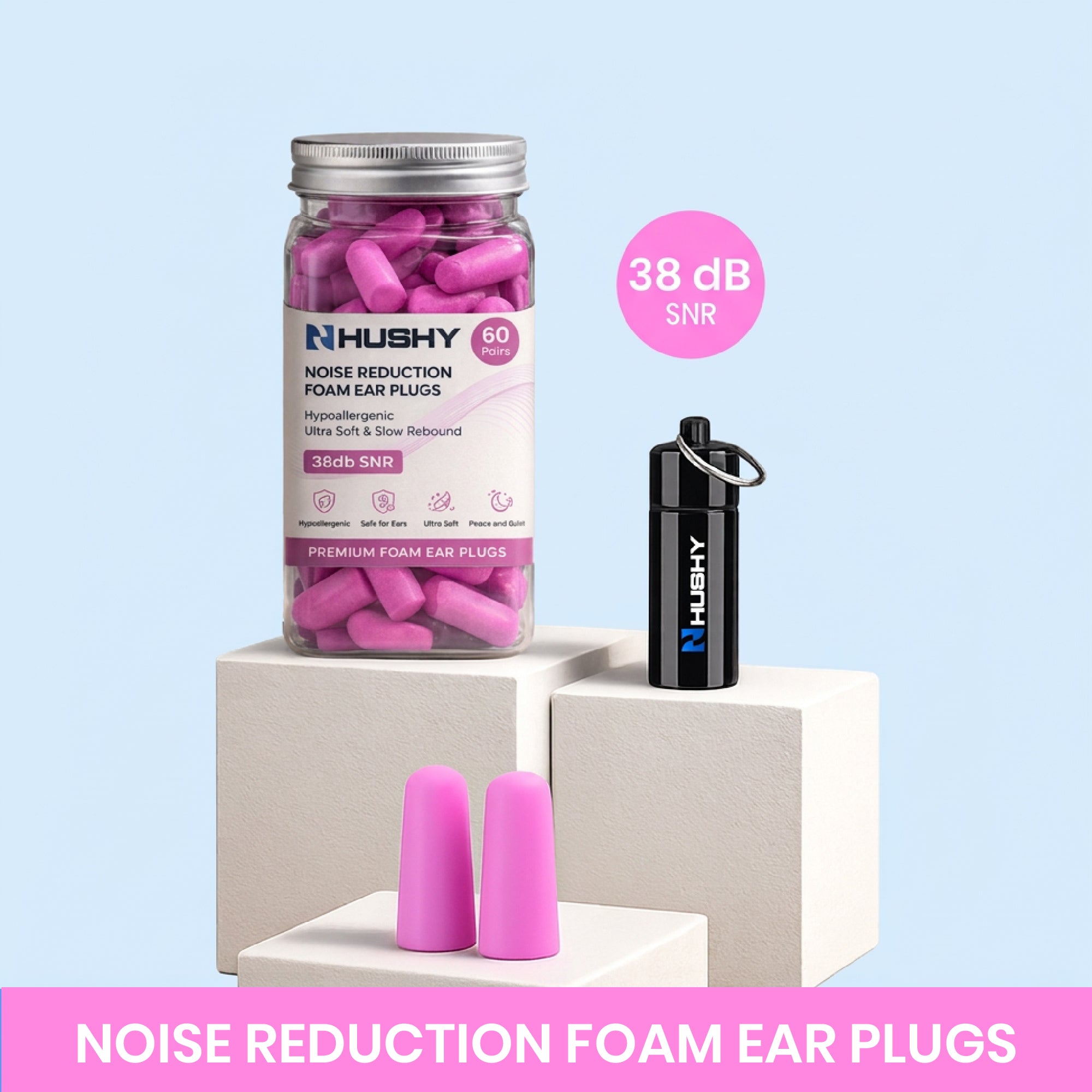 Hushy noise reduction foam ear plugs with packaging and ear plugs on a dark pink