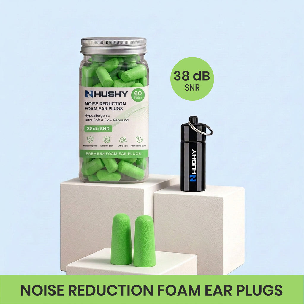 Hushy noise reduction foam ear plugs with packaging and ear plugs on a light green background