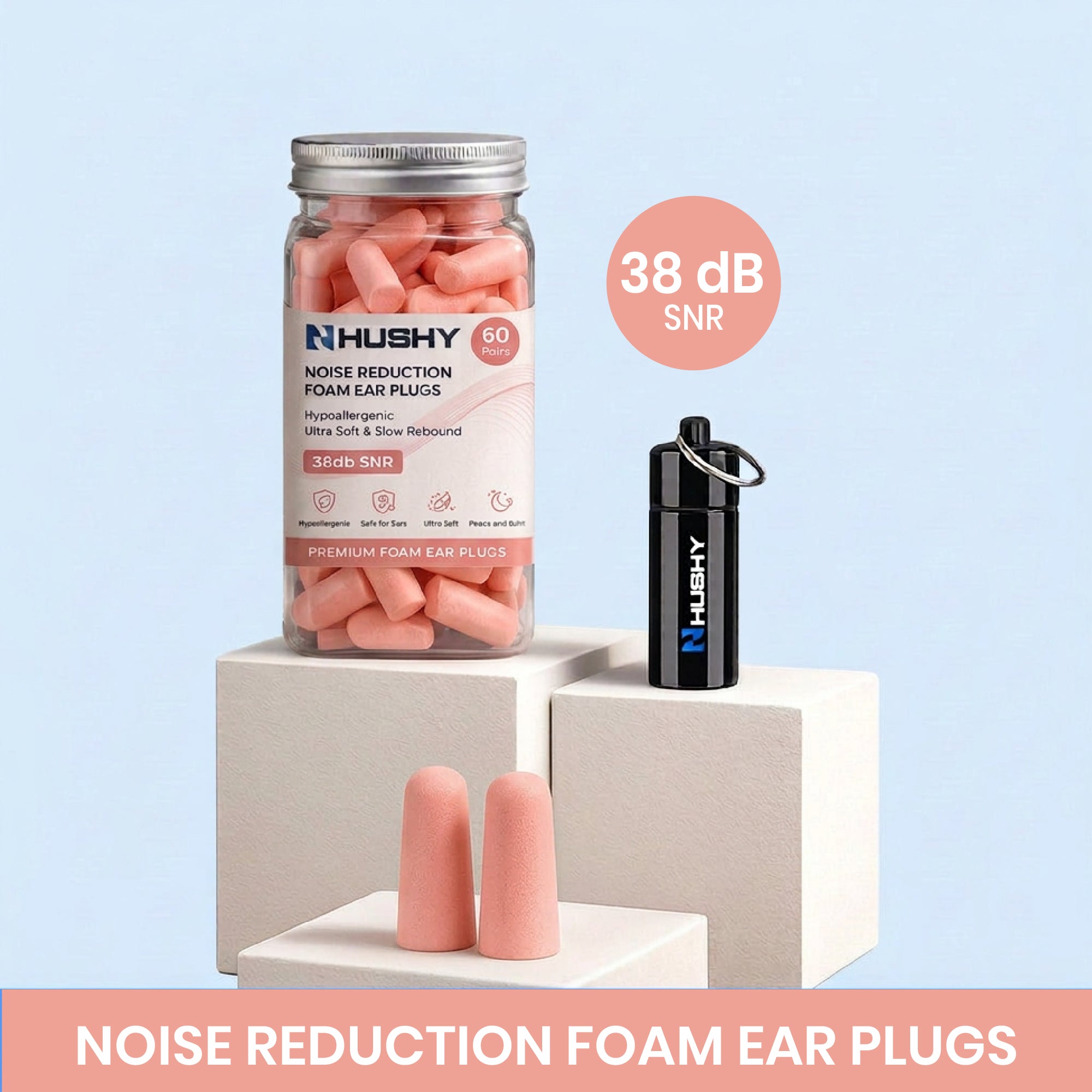 Hushy noise reduction foam ear plugs with packaging and ear plugs on a light pink background