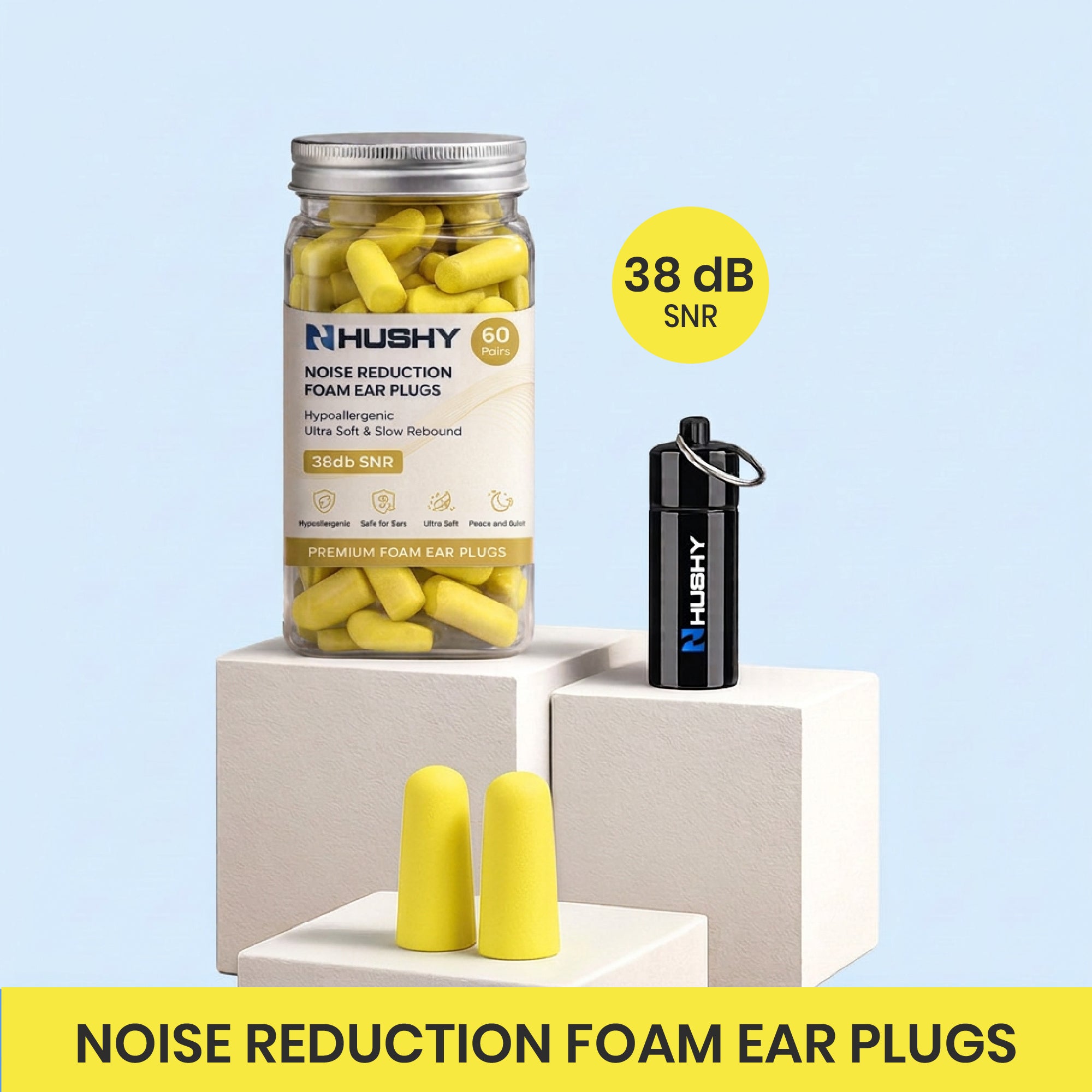 Hushy noise reduction foam ear plugs with packaging and ear plugs on a light blue background