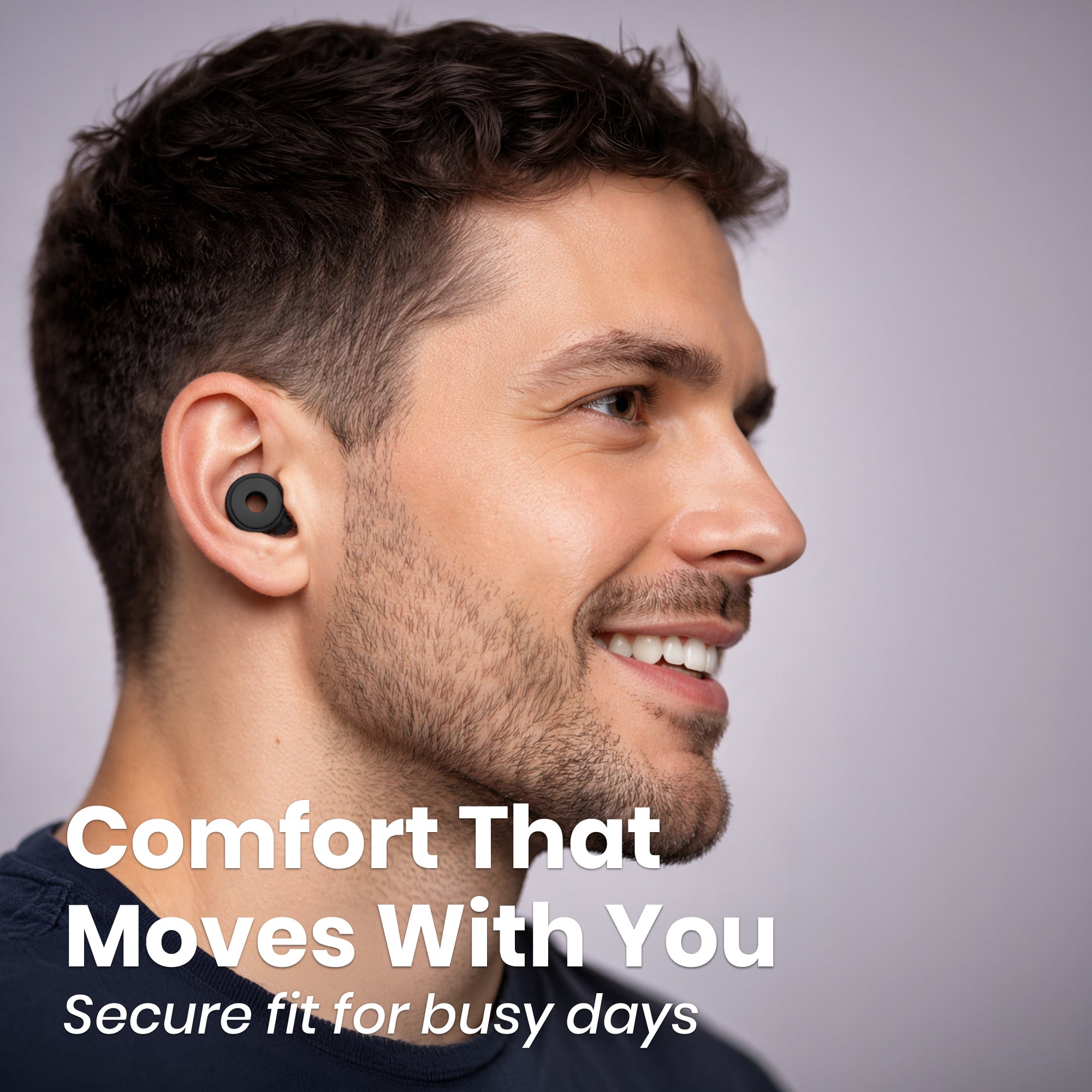 Man wearing a black wireless earbud with text 'Comfort That Moves With You' on a gray background