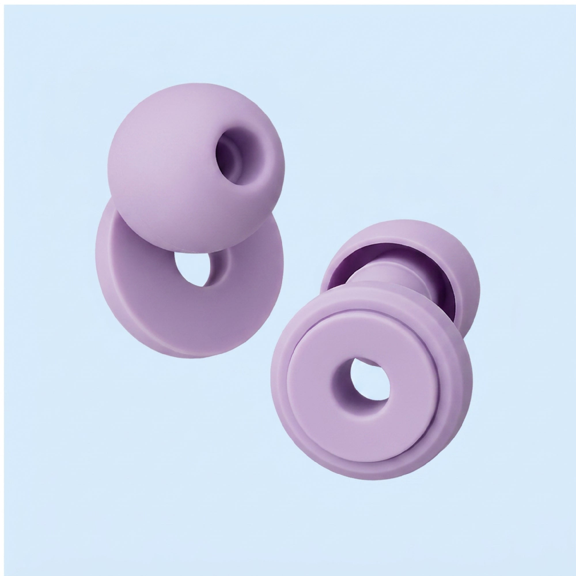 Purple silicone donut-shaped earrings on a light purple background