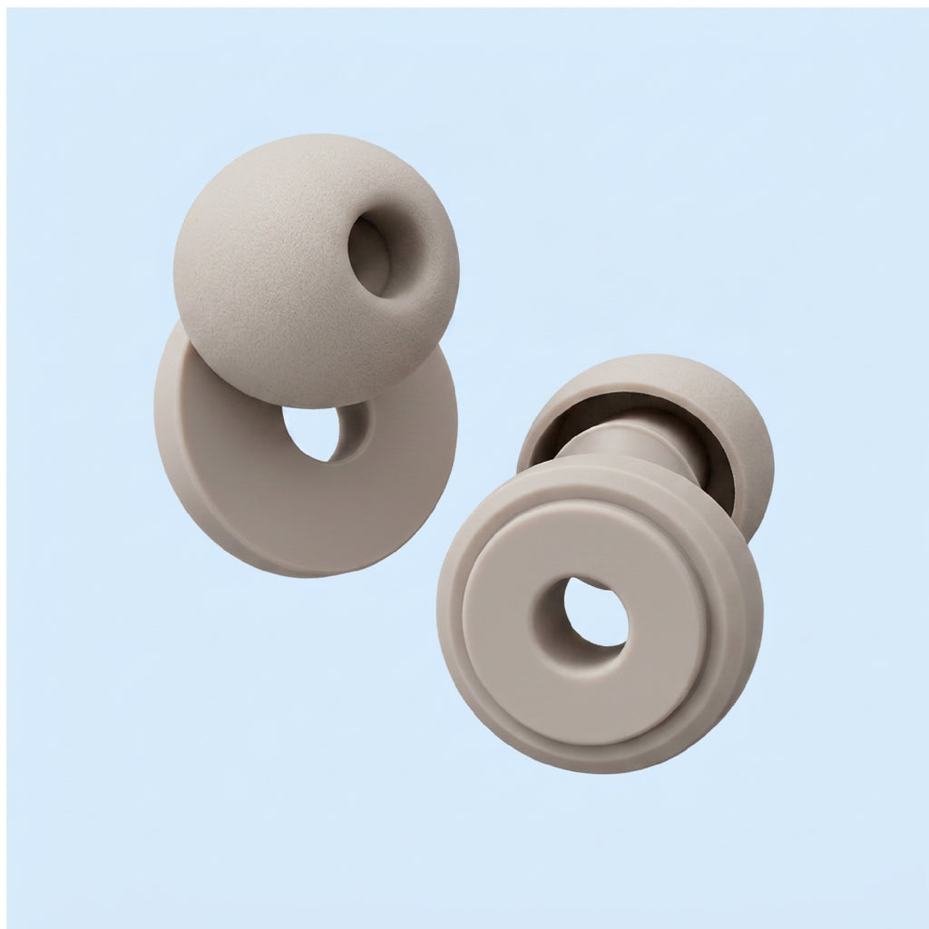 Two beige silicone donut-shaped chew toys on a light blue background