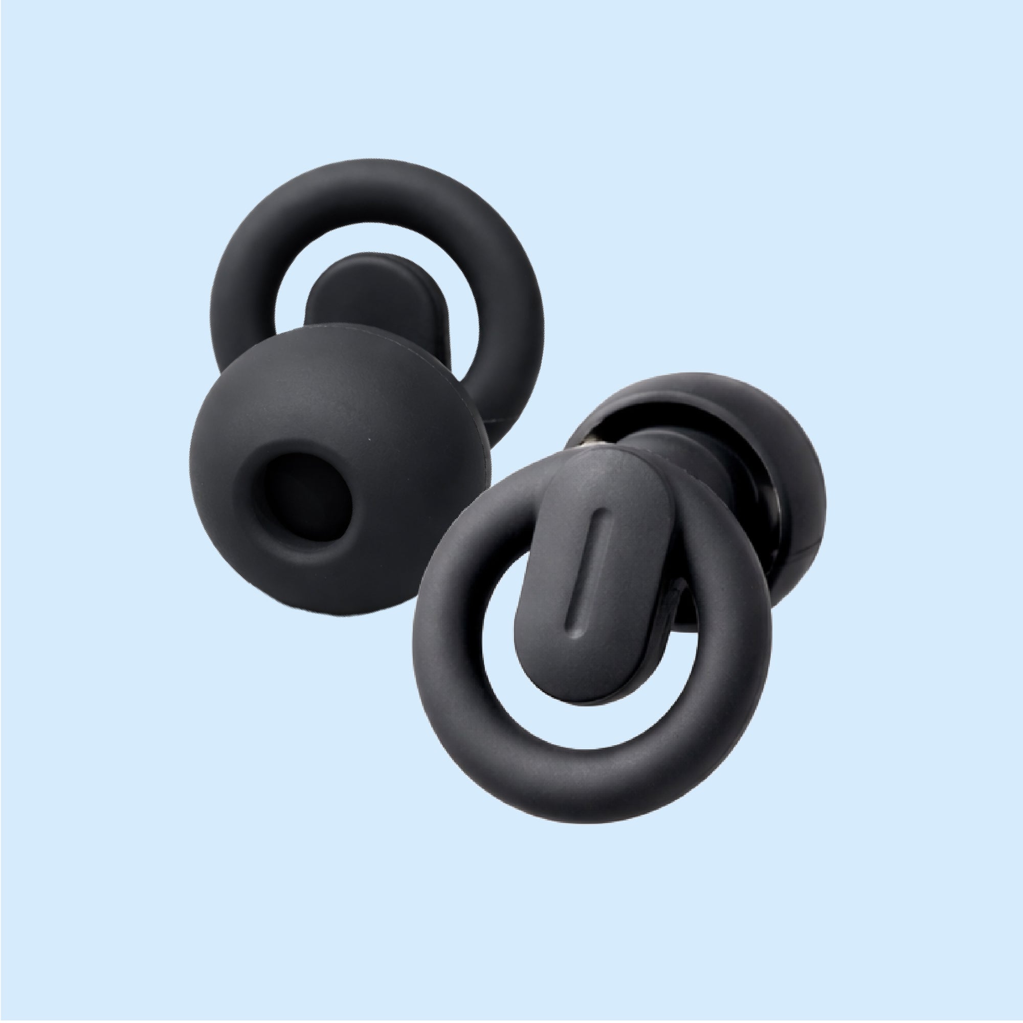 Black silicone earbud tips on a light blue background