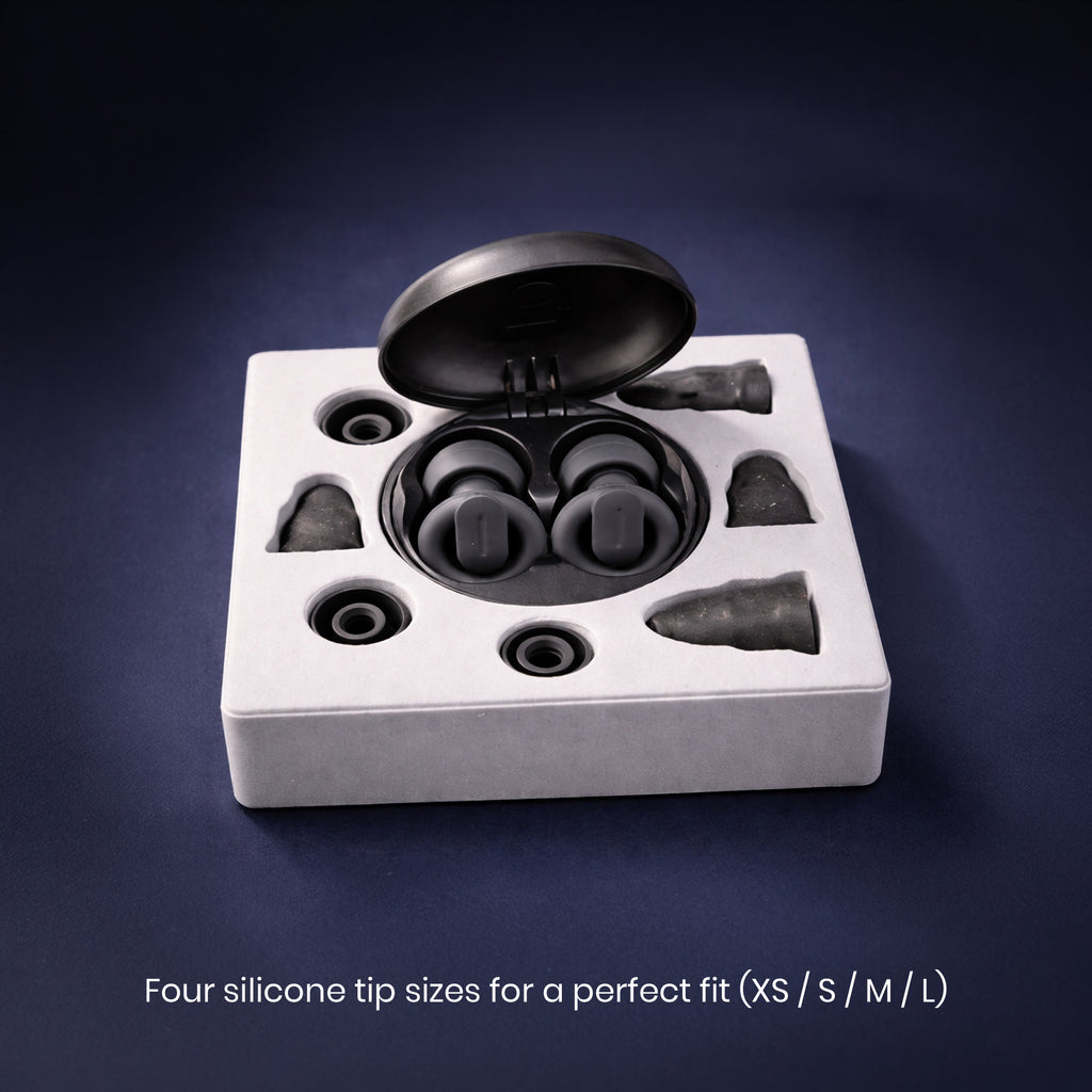 Set of silicone earbud tips in a box on a dark background